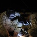 Seabees welding at night to beat the heat