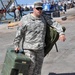 Soldiers offloads equipment