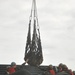 Sailors unload equipment from the U.S. Naval Ship Pillilaau