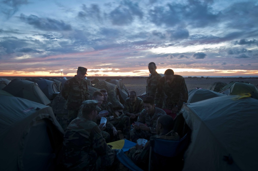 Service members enjoy a game cards