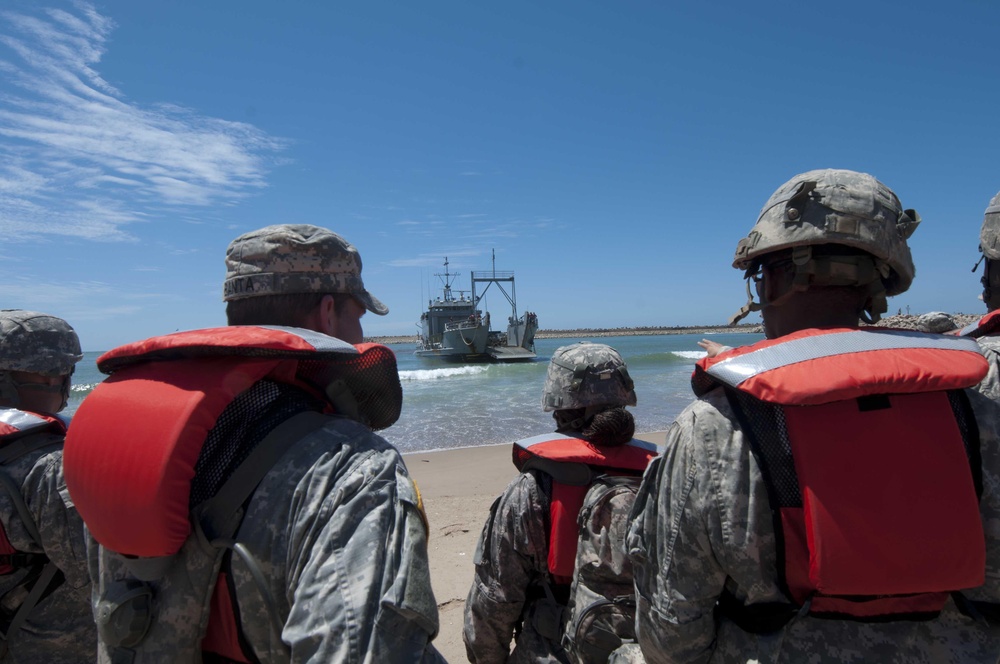 Service members awaits the arrival of Army Landing Craft Utility (LCU)