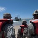 Service members awaits the arrival of Army Landing Craft Utility (LCU)