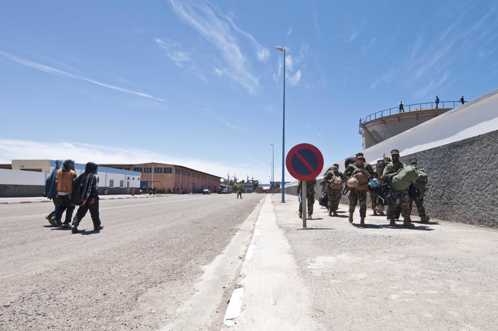 Service members move across the Port of Tan Tan