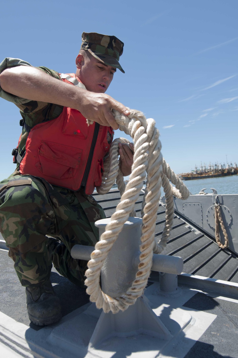 Seaman casts off a Landing Craft Mechanized (LCM) 847