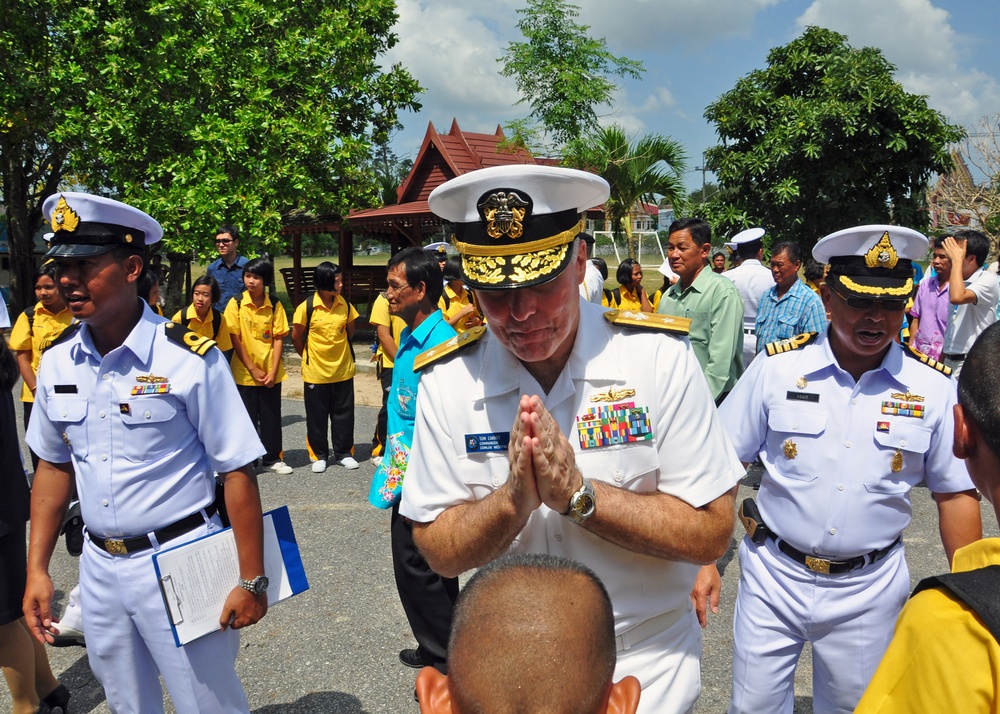 Rear Adm. Carney greets a boy during CARAT Thailand 2011