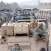 Soldiers relax on an M1068 Armored Personnel Carrier