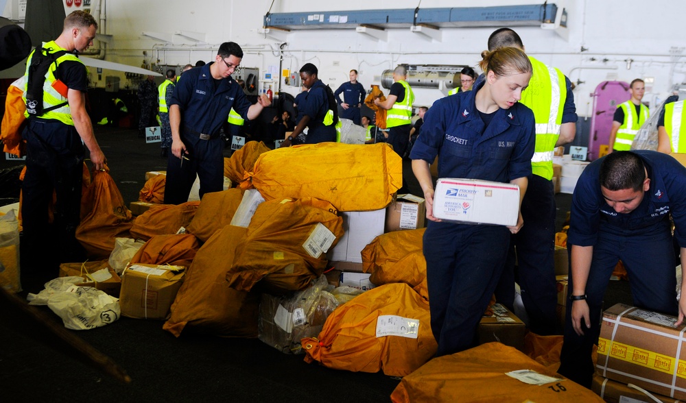 USS Carl Vinson sailors sort mail