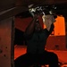 Sailor repairs a part on F/A-18C Hornet