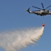 Helicopter drops water during exercise