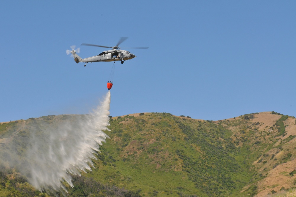 Helicopter drops water during exercise