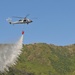 Helicopter drops water during exercise