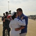 Petty Officer 2nd Class Amanda Stachey receives the first kiss from her husband during the amphibious assault ship USS Kearsarge return to Naval Station Norfolk