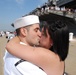 Seaman John Garland kisses his wife during the amphibious assault ship USS Kearsarge return to Naval Station Norfolk