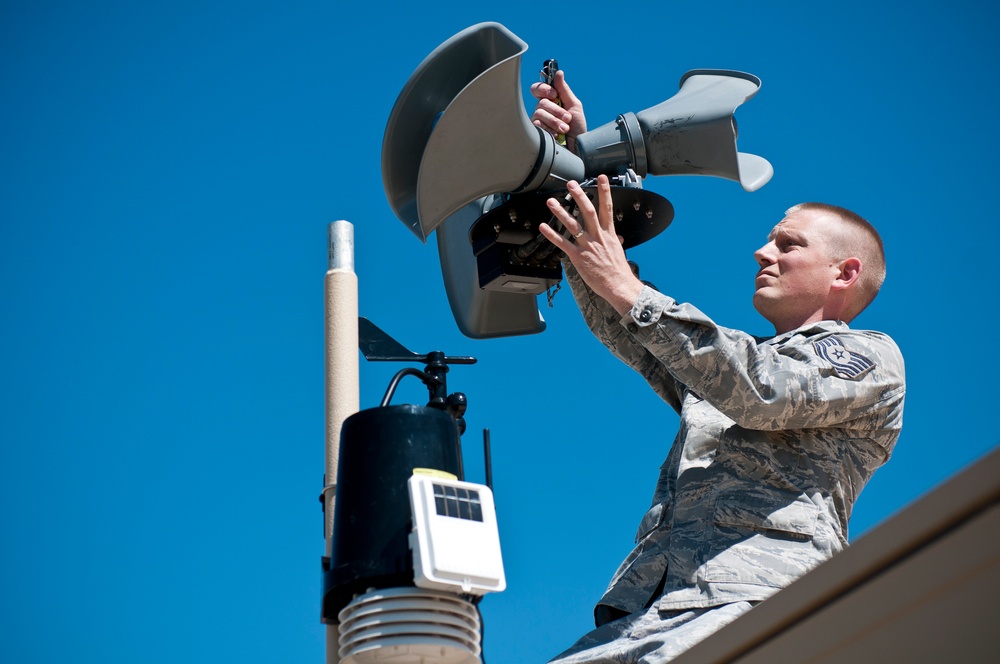 Tech. Sgt. Phil Seif with the 123rd Contingency Response Element installs a speaker system on top of the Hard sided Expandable Light Air Mobile Shelter in Springfield, Mo on May 16, 2011 during the National Level Exercise.