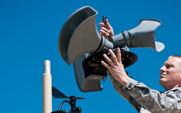 Tech. Sgt. Phil Seif with the 123rd Contingency Response Element installs a speaker system on top of the Hard sided Expandable Light Air Mobile Shelter in Springfield, Mo on May 16, 2011 during the National Level Exercise.
