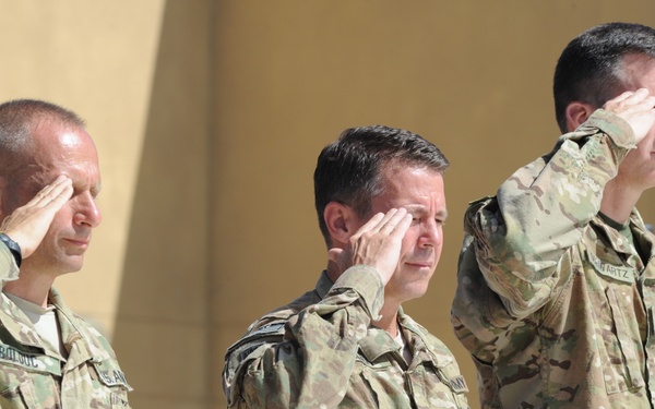 Command teams from CFSOCC-A salute during the National Anthem