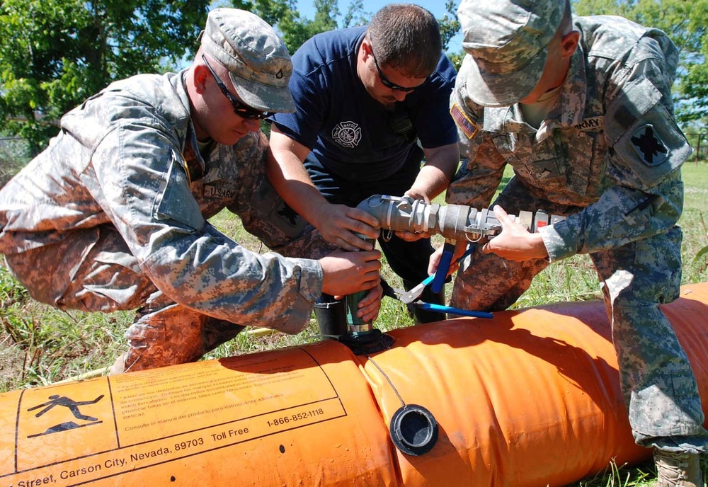 Tiger Brigade guardsmen lay Tiger Dam in Terrebonne