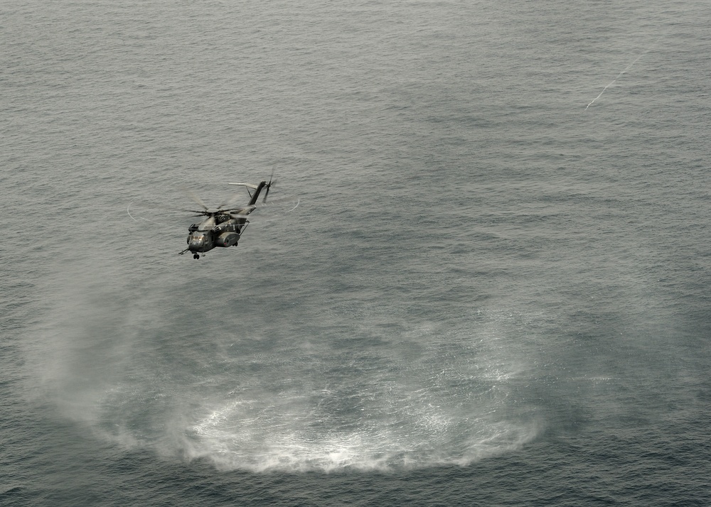 Navy helicopter deploys mine countermeasures in training