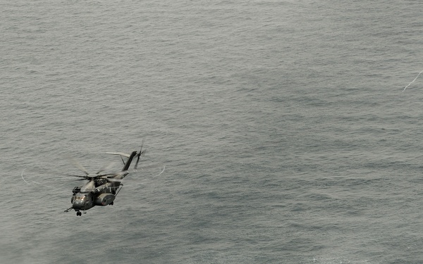 Navy helicopter deploys mine countermeasures in training