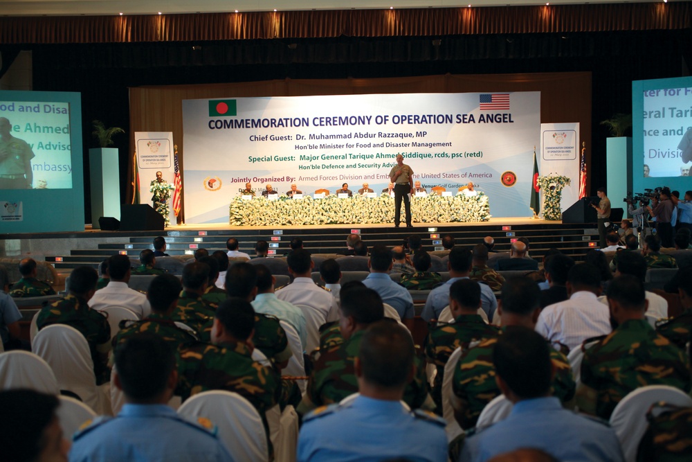 Marines with MWSS-472 wait to hand out toys and school supplies, while Bangladesh Army Maj. Muhammad