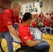 Commandant and Sergeant Major cheer All-Marine sitting volleyball team