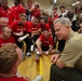 Commandant and Sergeant Major cheer All-Marine sitting volleyball team