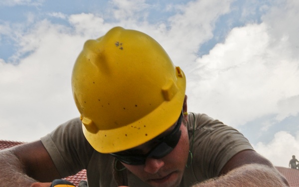 US Soldier cut gypsum board in Cambodia