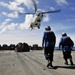 USS Whidbey Island sailors await supply drop