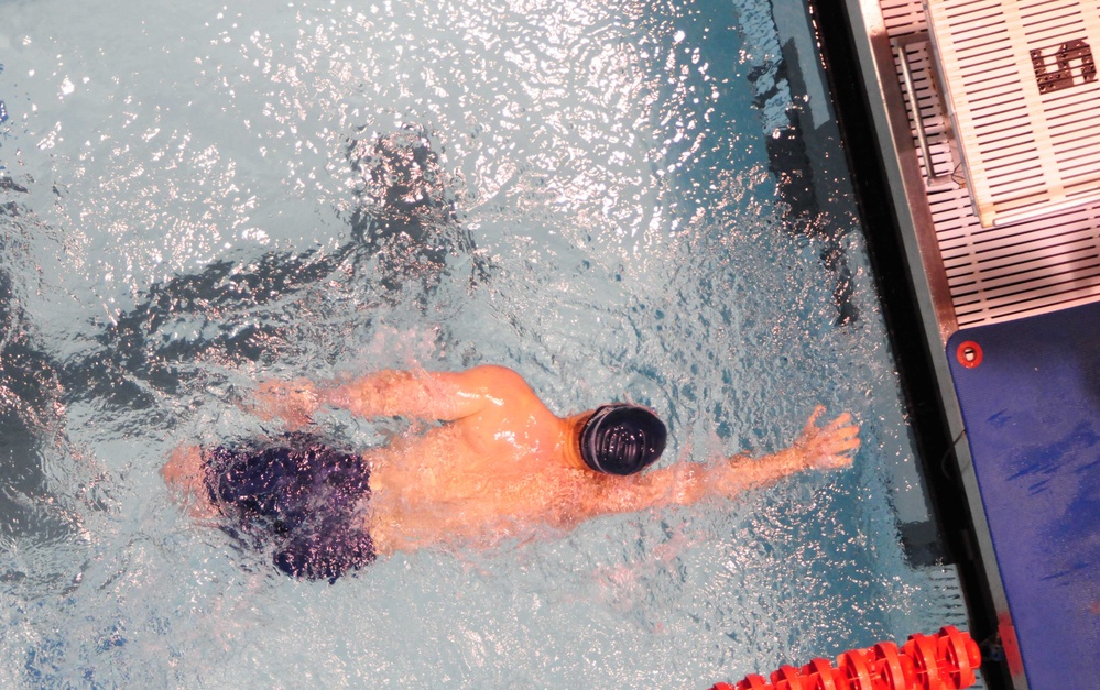 Navy/Coast Guard swimmer competes during prelims