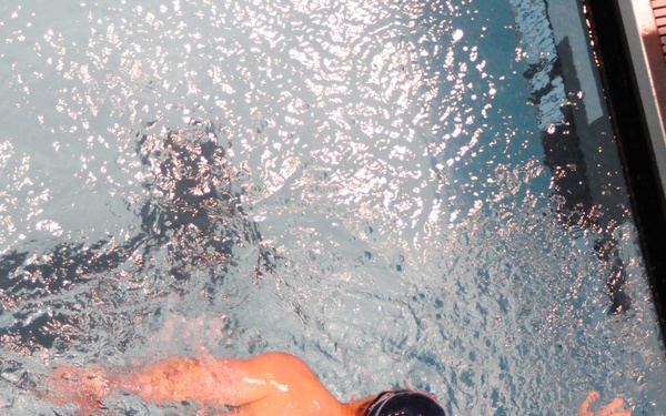 Navy/Coast Guard swimmer competes during prelims