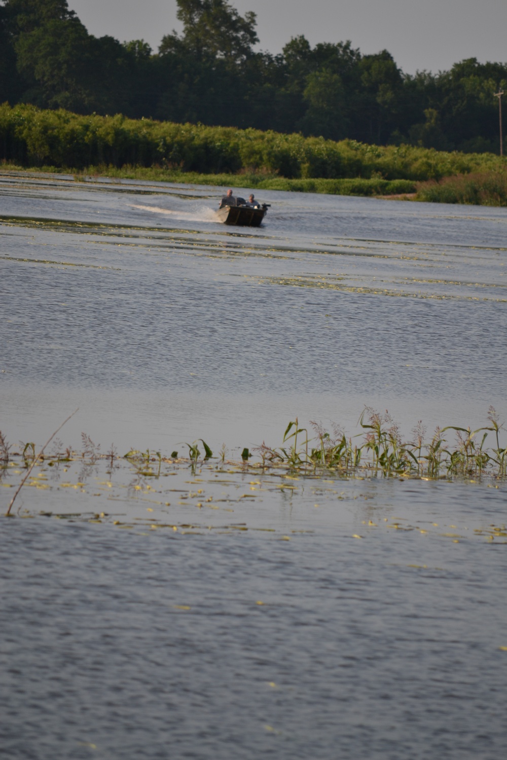 Boat becomes vehicle substitute over flooded land