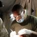 Sailors set up field dental station