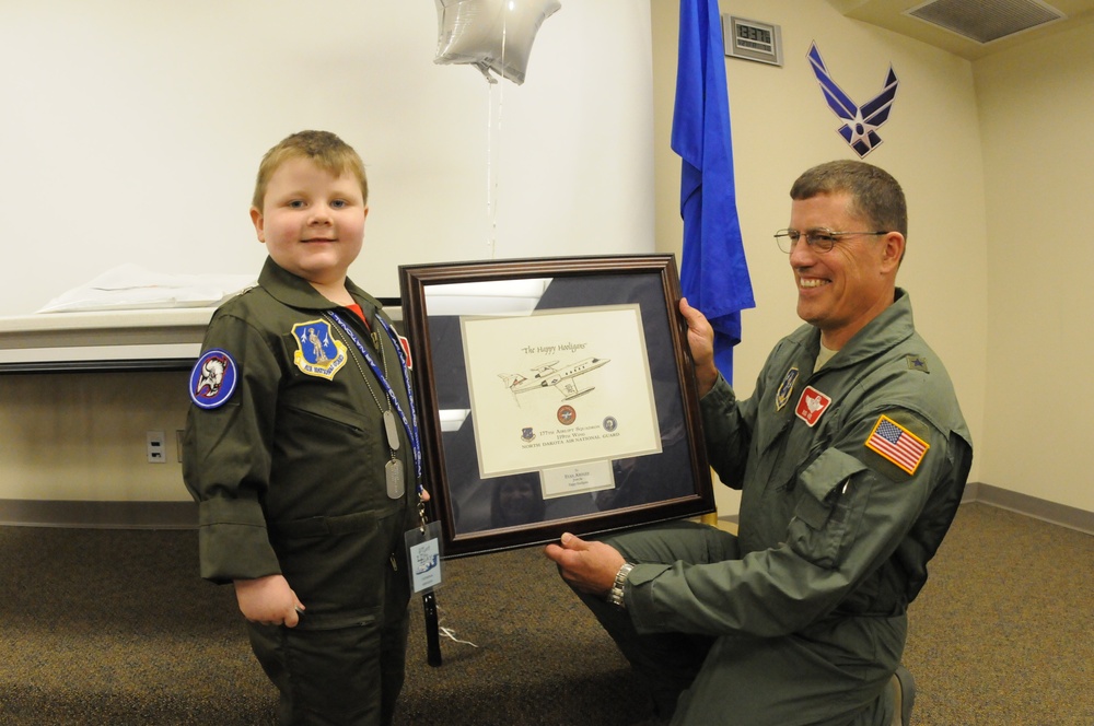 Young boy is pilot for the day at 119th Wing