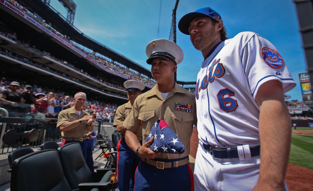 Marine honored at Mets game, Mets outfielder Nick Evans presents American flag