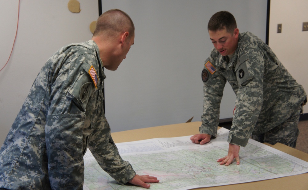 Sgt. Schmidt looks over strategy and operations