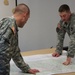 Sgt. Schmidt looks over strategy and operations