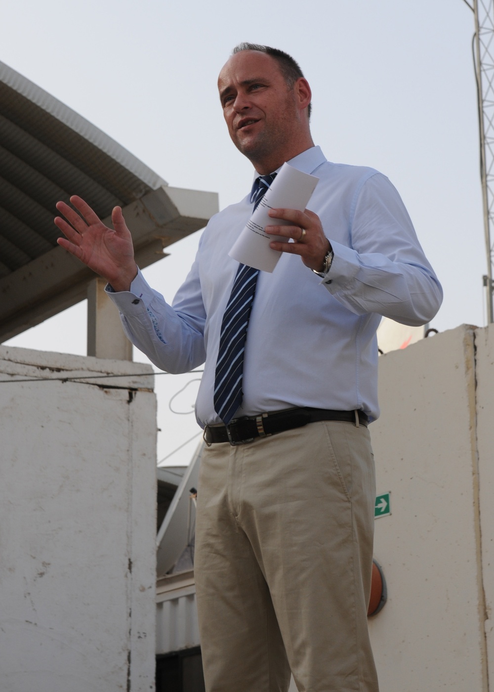 British Consul Gen. Richard Wood addresses an audience at a British Compound