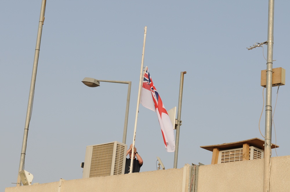 The British Naval Ensign flag is lowers at the British Compound on Contingency Operating Base Basra