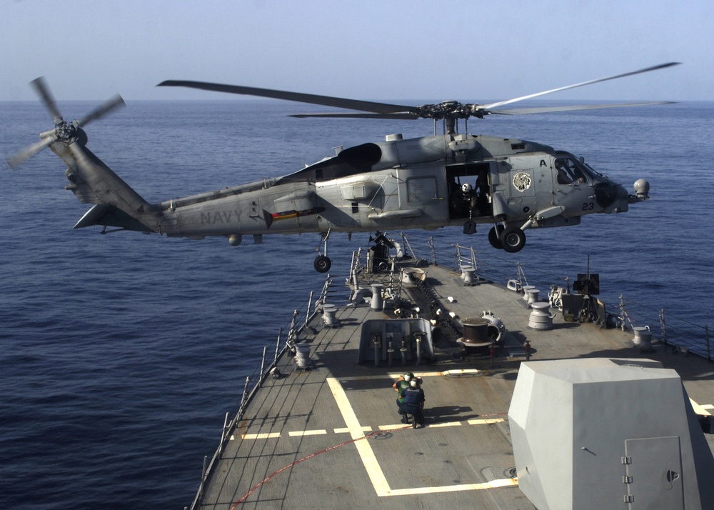 SH-60B Sea Hawk lowers cargo aboard USS Mason