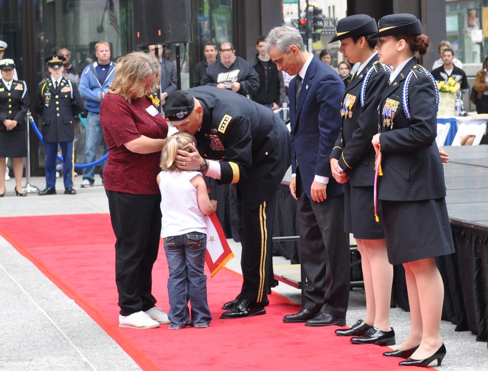 Gen. Odierno kisses forehead of Gold Star family member