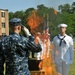 Sailors decommission flag