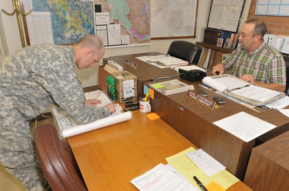 Guard members work flood with local authorities
