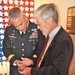 Jim Frazier, Survivor Outreach Services Coordinator gives Maj. Gen. Campbell a coin