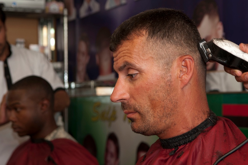 ISAF member gets his hair trimmed