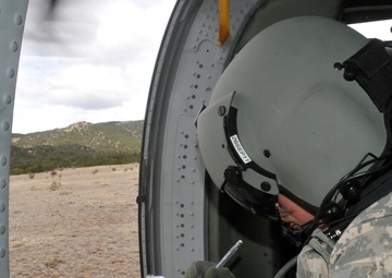 Clear up left! Clear up right! Corsair door gunners, crew chiefs take off in the Rockies
