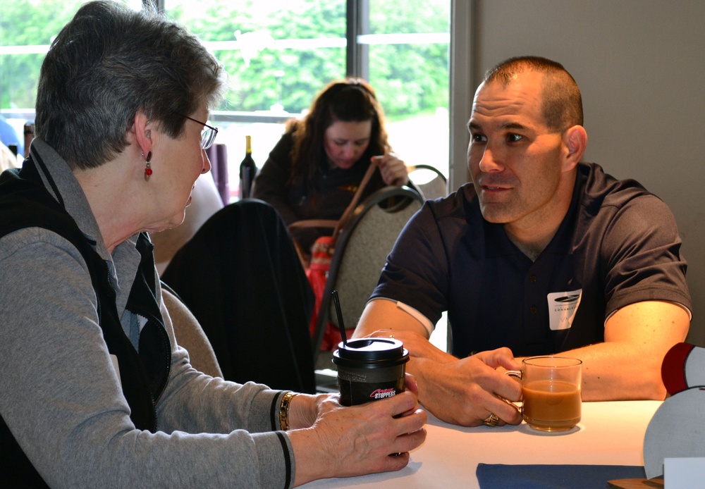 Annual Evergreen Fleet Cruise attendees engage in casual conversation