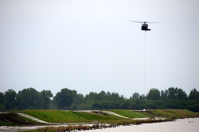 Missouri Guard Black Hawk drops sand bags on levee