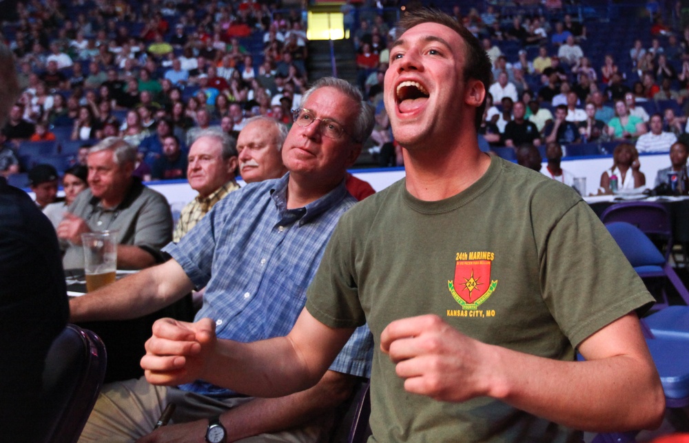 The crowd cheers on the Marines, St. Louis police and fire department