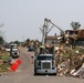 Joplin, Mo., June 7 - Contracted haul trucks work to remove millions of cubic yards of debris