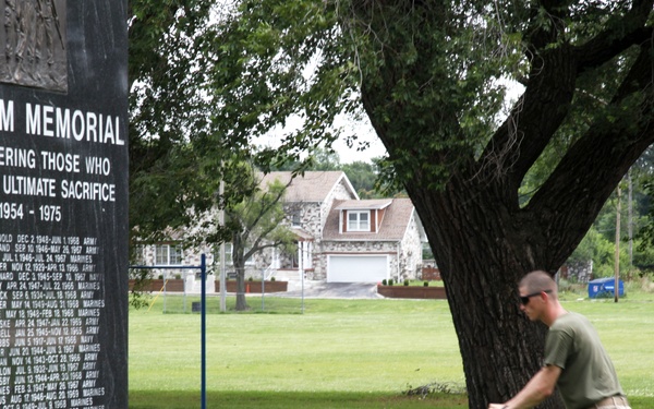 Marine mows grass at memorial